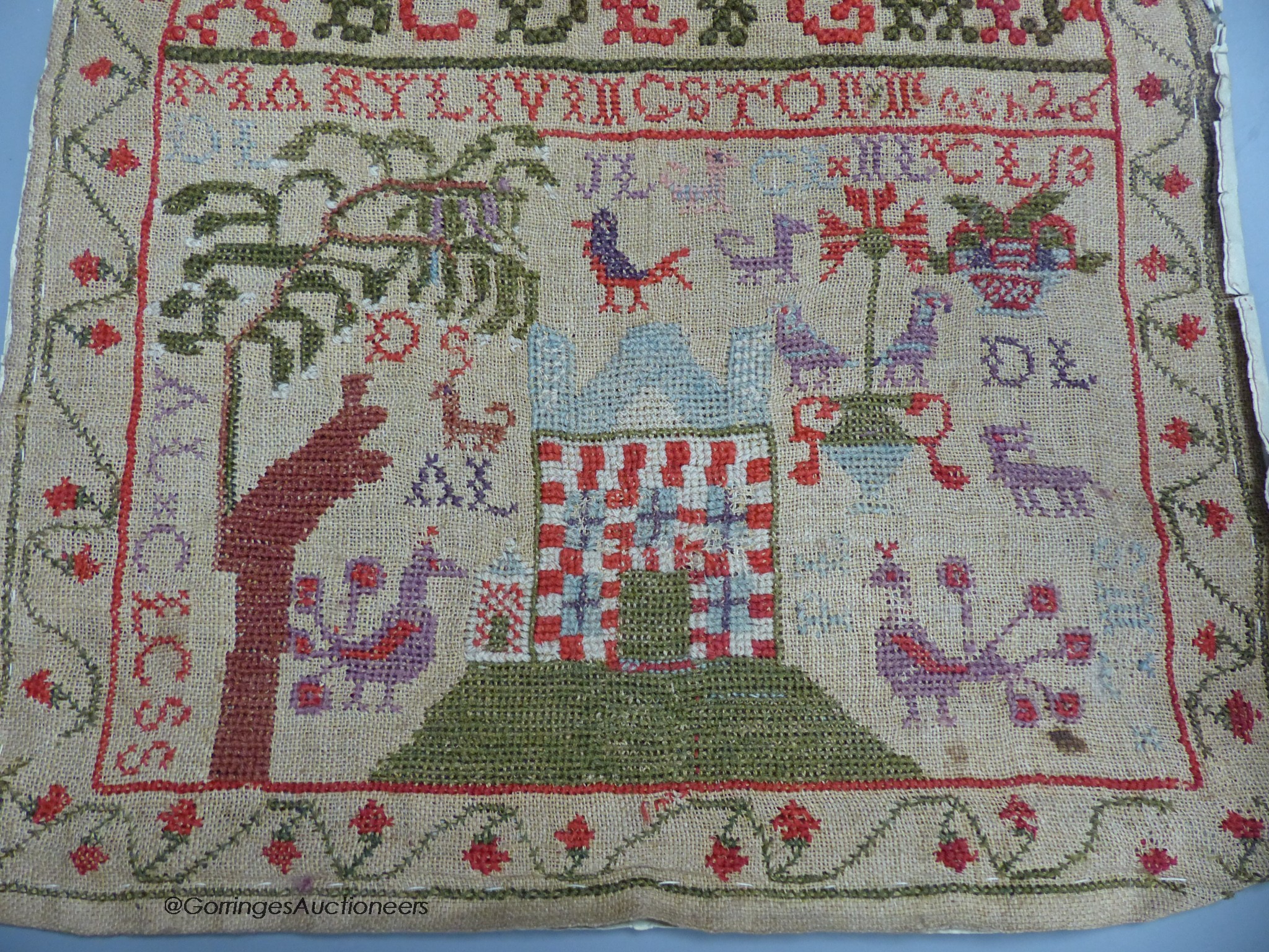 A cross stitch sampler, 41cm high, 29.5cm wide